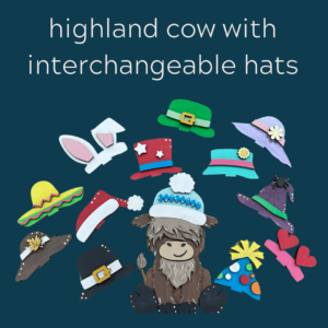 highland cow with interchangeable hats